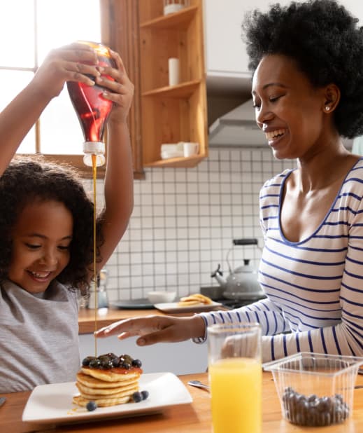 Happy family enjoying breakfast in their better mortgage home